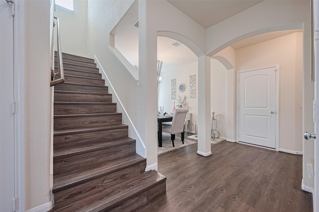 10434 Lake Of The Ozarks Dr, Humble, TX 77396 - stairs with arched walkways and wood finished floors