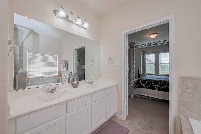 10434 Lake Of The Ozarks Dr, Humble, TX 77396 - full bathroom with ensuite bathroom, double vanity, and a tub