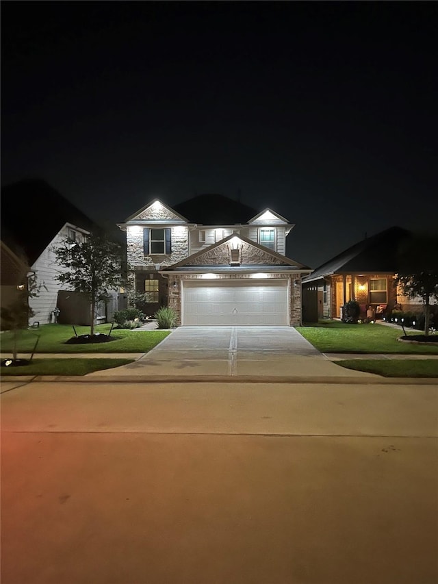 10434 Lake Of The Ozarks Dr, Humble, TX 77396 - view of front of home featuring stone siding, driveway, and a yard
