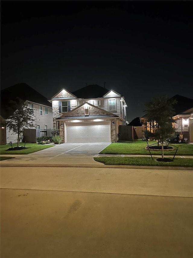 10434 Lake Of The Ozarks Dr, Humble, TX 77396 - view of front of house featuring concrete driveway, an attached garage, and stone siding