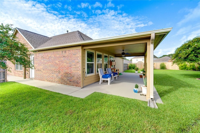 19238 Ashford Square St, Tomball, TX 77375 - back of property featuring a patio area, ceiling fan, brick siding, and roof with shingles