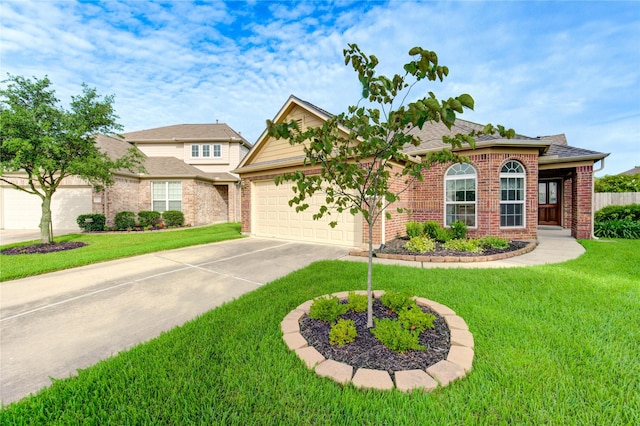 19238 Ashford Square St, Tomball, TX 77375 - view of front of house with an attached garage, driveway, brick siding, and a front yard