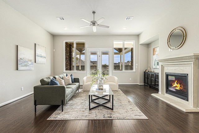 13603 Sandford Meadow Ln, Cypress, TX 77429 - living area featuring a ceiling fan, a glass covered fireplace, and dark wood-style flooring