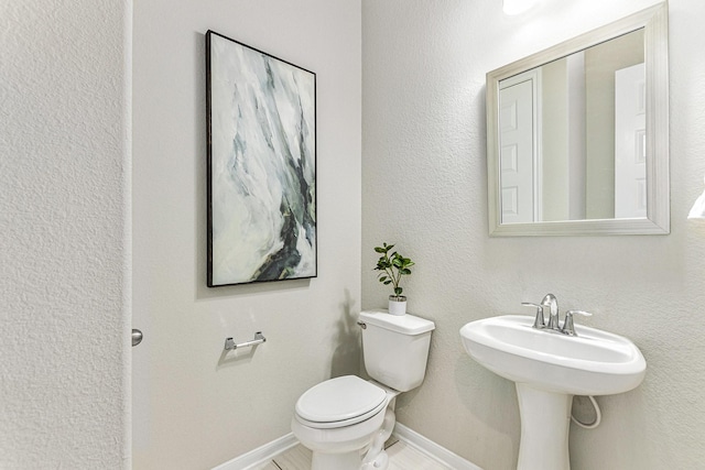 13603 Sandford Meadow Ln, Cypress, TX 77429 - bathroom with toilet and baseboards