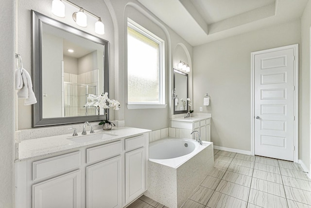 13603 Sandford Meadow Ln, Cypress, TX 77429 - full bathroom featuring a bath, a shower stall, and two vanities