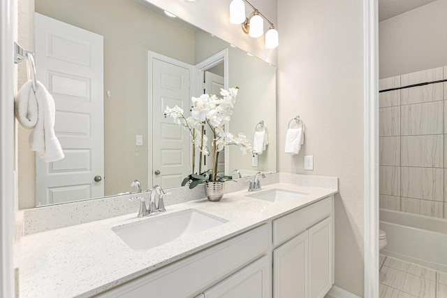 13603 Sandford Meadow Ln, Cypress, TX 77429 - bathroom featuring double vanity and shower / washtub combination