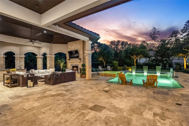 27 S Glenwild Cir, The Woodlands, TX 77389 - view of patio / terrace with a pool with connected hot tub, an outdoor living space with a fireplace, and a ceiling fan