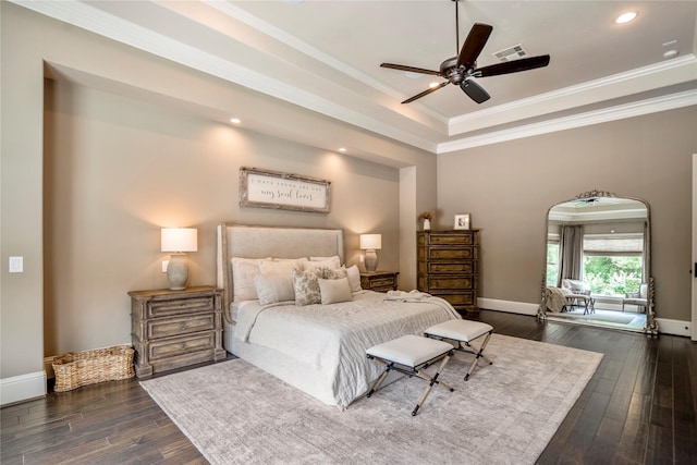 27 S Glenwild Cir, The Woodlands, TX 77389 - bedroom featuring dark wood finished floors, ornamental molding, a tray ceiling, recessed lighting, and arched walkways