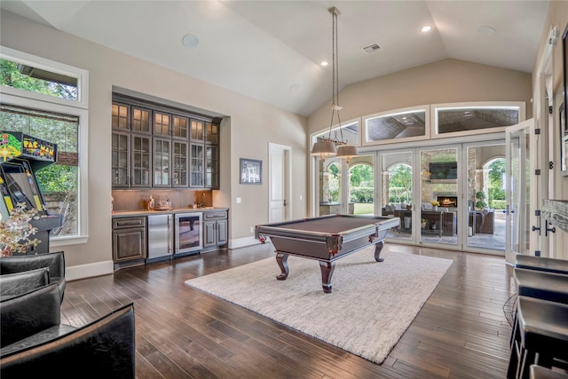 27 S Glenwild Cir, The Woodlands, TX 77389 - recreation room with beverage cooler, bar with sink, pool table, dark wood-type flooring, and high vaulted ceiling
