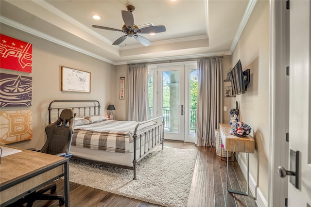 27 S Glenwild Cir, The Woodlands, TX 77389 - bedroom featuring access to outside, a raised ceiling, wood finished floors, ornamental molding, and recessed lighting