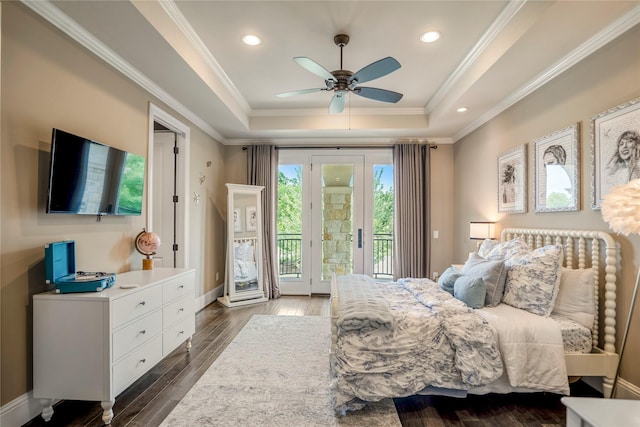 27 S Glenwild Cir, The Woodlands, TX 77389 - bedroom with access to exterior, a tray ceiling, crown molding, dark wood-type flooring, and recessed lighting