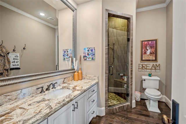 27 S Glenwild Cir, The Woodlands, TX 77389 - full bathroom featuring crown molding, vanity, wood finished floors, a stall shower, and recessed lighting