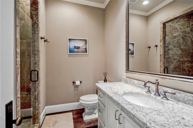 27 S Glenwild Cir, The Woodlands, TX 77389 - full bathroom featuring ornamental molding, vanity, a shower stall, and wood finished floors