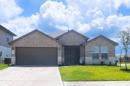 8227 Precious Passing Way, Rosharon, TX 77583 - single story home with a front lawn, concrete driveway, and a garage