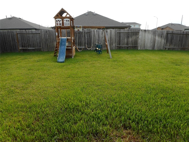 8227 Precious Passing Way, Rosharon, TX 77583 - fenced backyard with a playground
