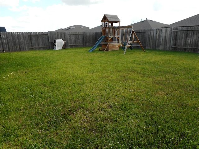 8227 Precious Passing Way, Rosharon, TX 77583 - fenced backyard with a playground