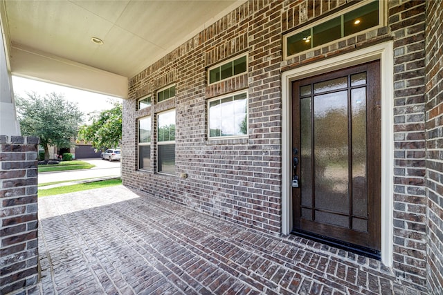 19503 S Coral Honeysuckle Loop, Cypress, TX 77433 - doorway to property with covered porch and brick siding