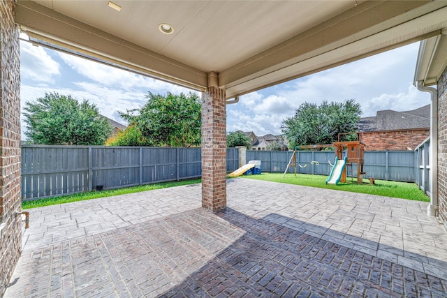 19503 S Coral Honeysuckle Loop, Cypress, TX 77433 - fenced backyard with a playground and a patio area