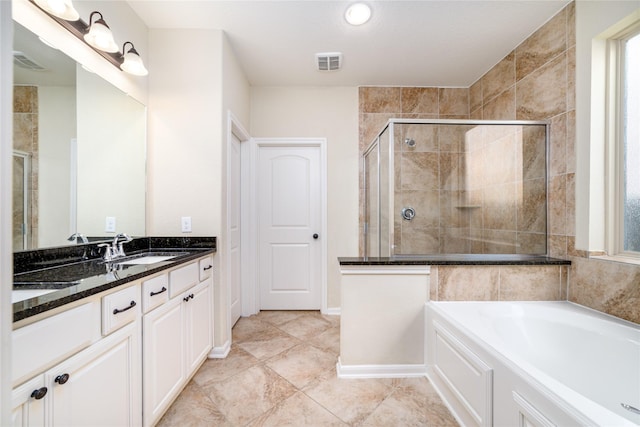 19503 S Coral Honeysuckle Loop, Cypress, TX 77433 - full bathroom featuring vanity, a stall shower, a garden tub, and tile patterned floors