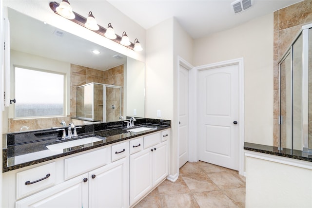 19503 S Coral Honeysuckle Loop, Cypress, TX 77433 - bathroom with a shower stall and double vanity