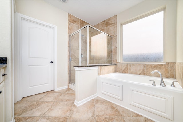 19503 S Coral Honeysuckle Loop, Cypress, TX 77433 - bathroom featuring a garden tub and a stall shower
