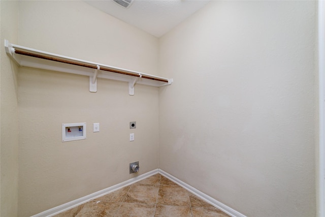 19503 S Coral Honeysuckle Loop, Cypress, TX 77433 - laundry area featuring electric dryer hookup, hookup for a washing machine, and light tile patterned floors