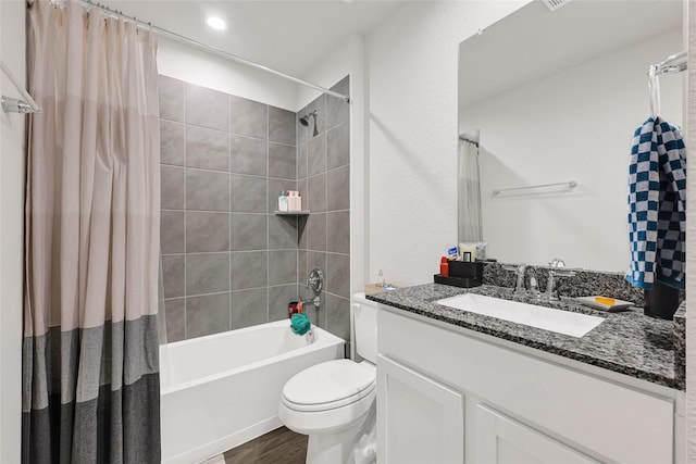 225 Big Spring Dr, Anahuac, TX 77514 - bathroom with vanity, shower / bath combination with curtain, and wood finished floors