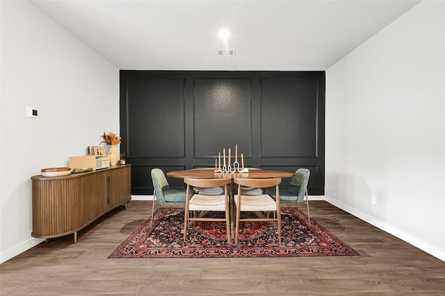 225 Big Spring Dr, Anahuac, TX 77514 - dining space with baseboards and wood finished floors