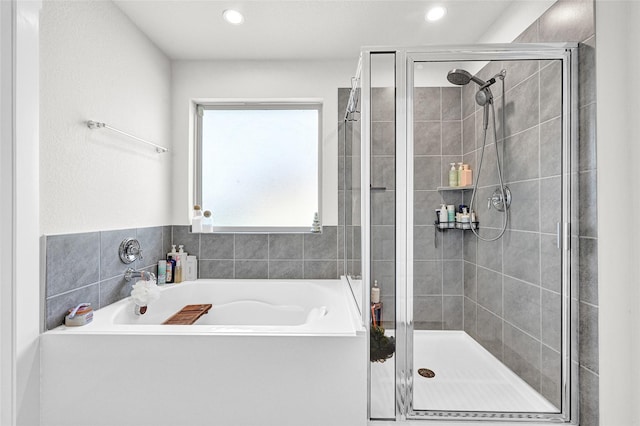 225 Big Spring Dr, Anahuac, TX 77514 - full bathroom with a bath, a stall shower, and recessed lighting