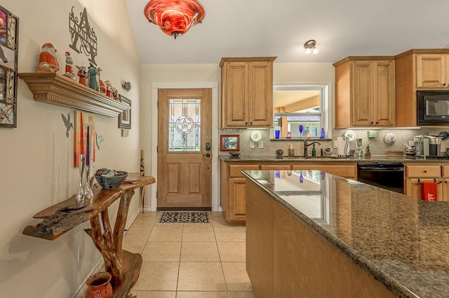 33 Lakeside, Trinity, TX 75862 - kitchen featuring black appliances, tasteful backsplash, light tile patterned floors, dark stone counters, and vaulted ceiling