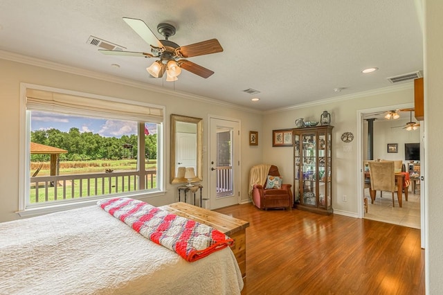 33 Lakeside, Trinity, TX 75862 - bedroom featuring access to outside, wood finished floors, ornamental molding, recessed lighting, and ceiling fan