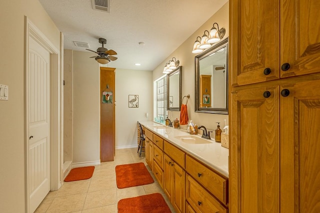 33 Lakeside, Trinity, TX 75862 - bathroom featuring double vanity, tile patterned floors, ceiling fan, and a shower