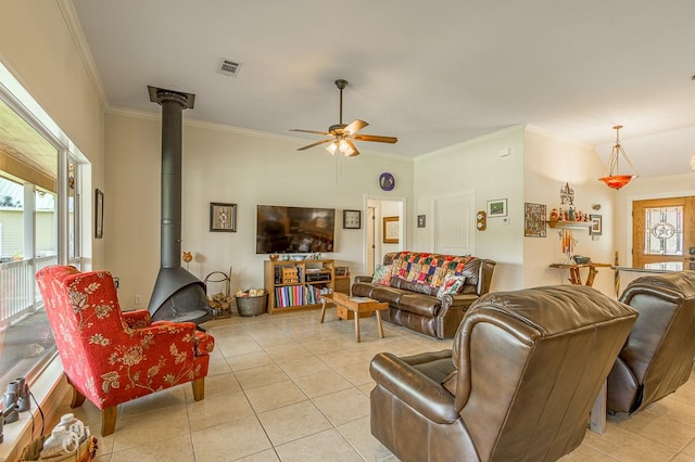 33 Lakeside, Trinity, TX 75862 - living room with a wood stove, ornamental molding, ceiling fan, and light tile patterned floors