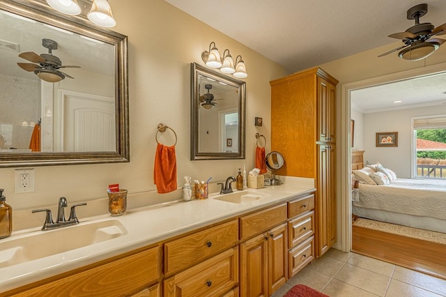 33 Lakeside, Trinity, TX 75862 - ensuite bathroom featuring a ceiling fan, tile patterned flooring, double vanity, and crown molding