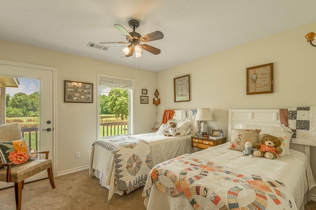 33 Lakeside, Trinity, TX 75862 - carpeted bedroom featuring access to exterior and ceiling fan