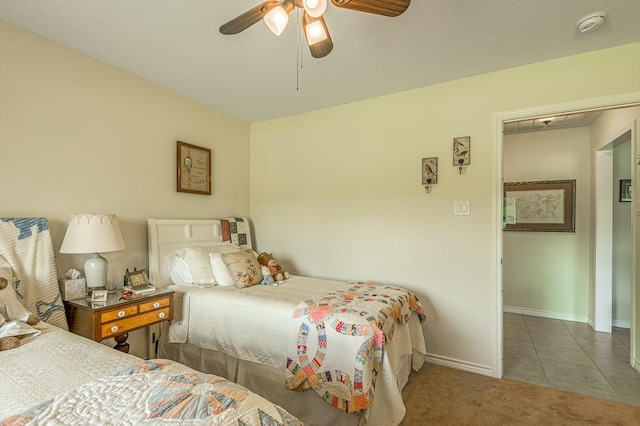 33 Lakeside, Trinity, TX 75862 - tiled bedroom featuring ceiling fan and carpet floors