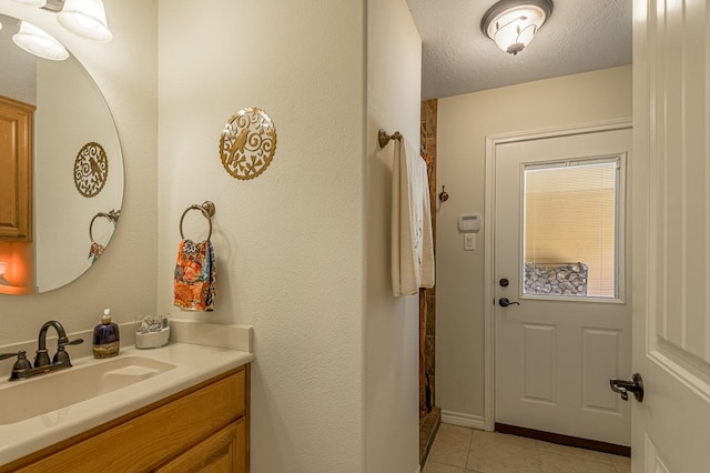 33 Lakeside, Trinity, TX 75862 - full bath with vanity, tile patterned floors, and a textured ceiling
