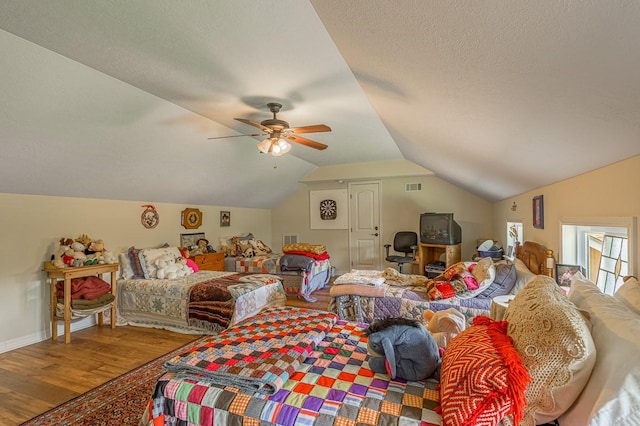 33 Lakeside, Trinity, TX 75862 - bedroom featuring wood finished floors, vaulted ceiling, and ceiling fan