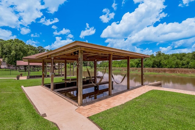 33 Lakeside, Trinity, TX 75862 - dock featuring a water view, a lawn, and boat lift