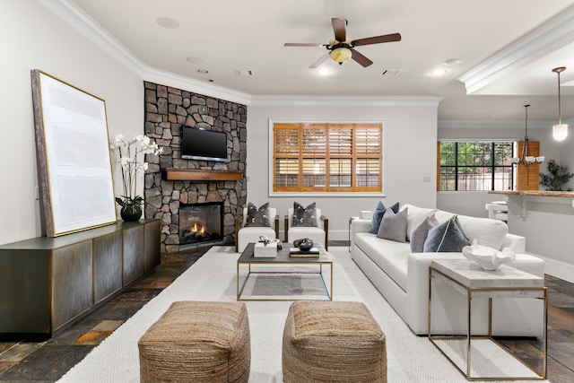 1013 Mulberry Ln, Bellaire, TX 77401 - living room featuring ornamental molding, ceiling fan, a fireplace, and a chandelier