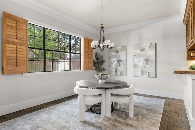 1013 Mulberry Ln, Bellaire, TX 77401 - dining area with a chandelier, crown molding, and stone tile floors