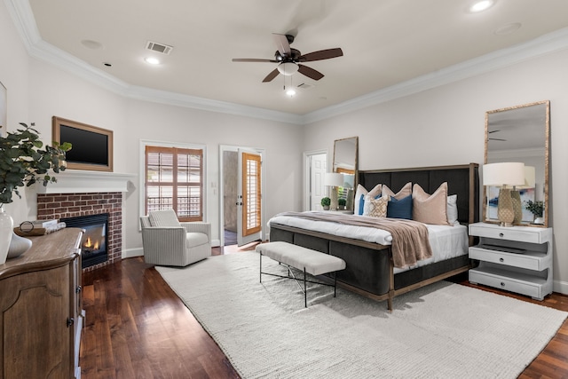 1013 Mulberry Ln, Bellaire, TX 77401 - bedroom with wood finished floors, ornamental molding, a brick fireplace, recessed lighting, and access to exterior