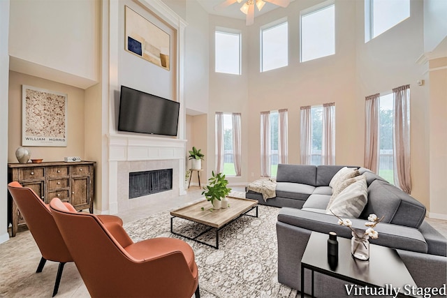 1814 Ferndale Lake Ct, Richmond, TX 77406 - living area featuring plenty of natural light, a fireplace, a high ceiling, and a ceiling fan