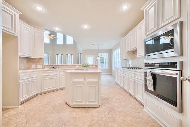 1814 Ferndale Lake Ct, Richmond, TX 77406 - kitchen with oven, built in microwave, tasteful backsplash, light countertops, and recessed lighting