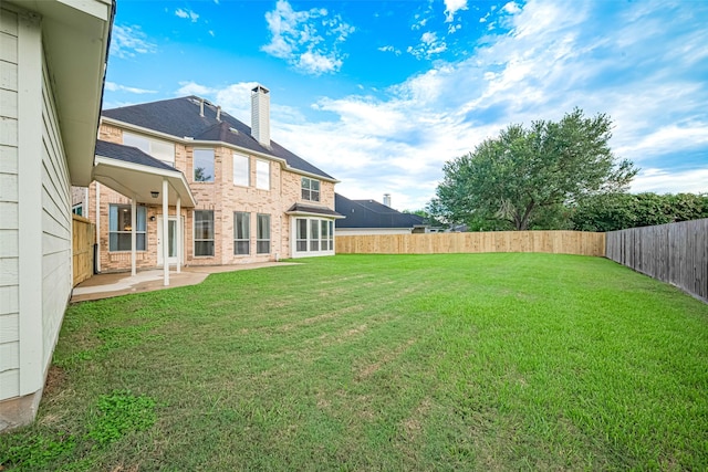 1814 Ferndale Lake Ct, Richmond, TX 77406 - fenced backyard with a patio
