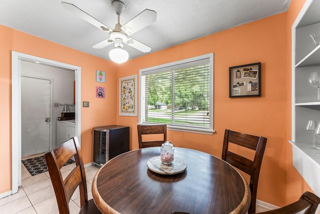 6103 Sunnygate Dr, Spring, TX 77373 - dining area with light tile patterned floors, a ceiling fan, and a textured ceiling