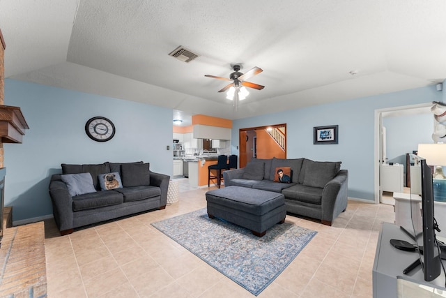 6103 Sunnygate Dr, Spring, TX 77373 - living area featuring a ceiling fan, light tile patterned flooring, and vaulted ceiling