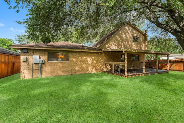 6103 Sunnygate Dr, Spring, TX 77373 - rear view of property featuring a fenced backyard, a patio, brick siding, and a chimney