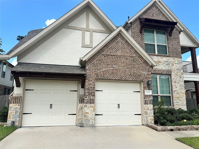 32052 Autumn Orchard Ln, Conroe, TX 77385 - view of front facade with stone siding, brick siding, driveway, and stucco siding