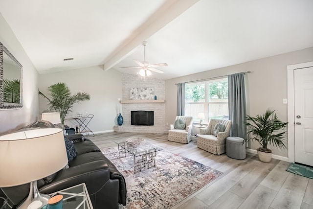 22002 Silver Lode Dr, Katy, TX 77450 - living area featuring a ceiling fan, wood finished floors, and a large fireplace